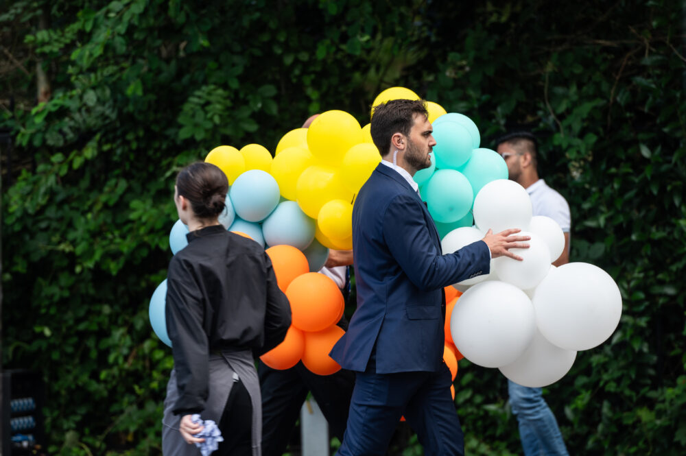 Summer Party London Story Events Man Carrying Balloon