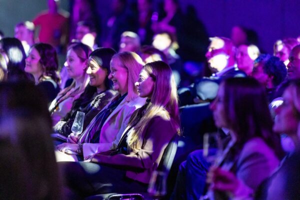 Guests at Evolution London under purple lighting